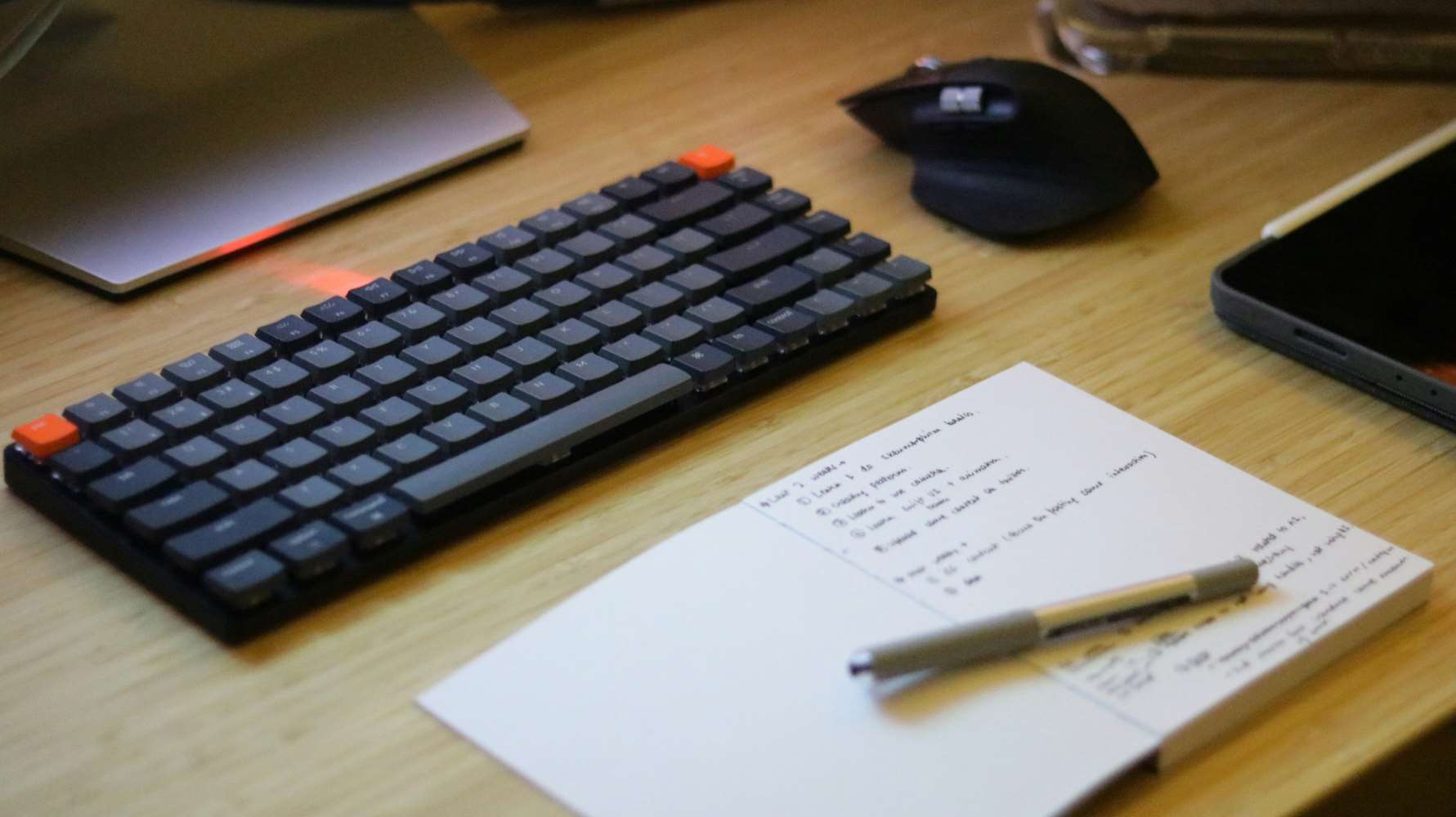 person working at laptop and notebook